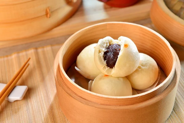 Dumplings of dense Dousha on bamboo tray in restaurant