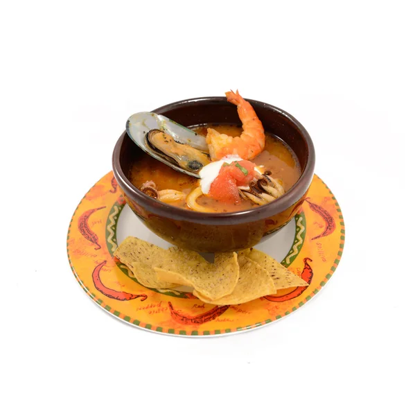 Mexican style of seafood soup with shrimp, salmon and clams in b