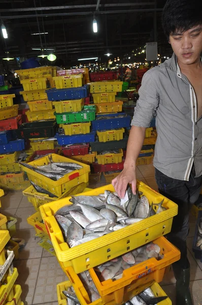 Ho Chi Minh City, Vietnam - November 28, 2013: Plenty of fisheries in baskets are waiting for purchasing at the Binh Dien wholesale night seafood market, the biggest one in Ho Chi Minh city, Vietnam