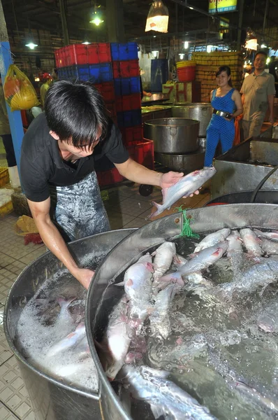 Ho Chi Minh City, Vietnam - November 28, 2013: Plenty of fisheries in tanks are waiting for purchasing at the Binh Dien wholesale seafood market, the biggest one in Ho Chi Minh city, Vietnam