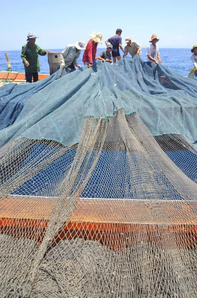 Nha Trang, Vietnam - May 5, 2012: Fishermen are trawling for tuna fish in the sea of Nha Trang bay in Vietnam