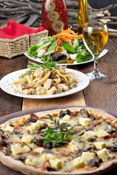 Restaurant Meal of Pizza, Pasta, Salad and Drink