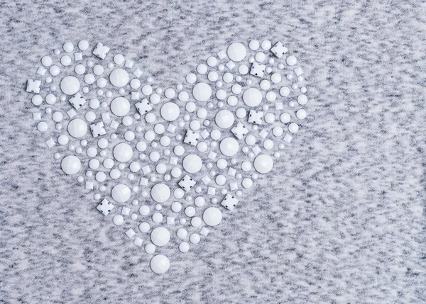 Texture of gray and white knitted heart