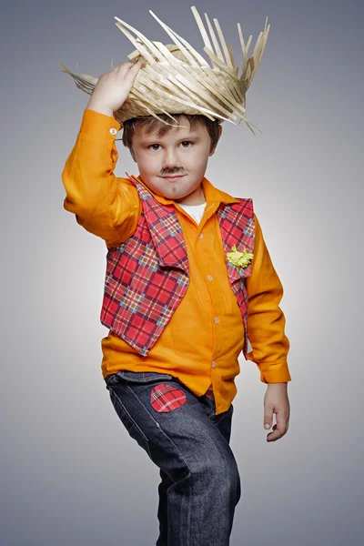 Small boy with drawn beard and hat