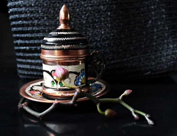 Turkish  coffe in a little cup in ludic folklore style