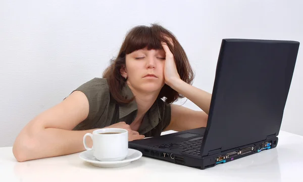 Young girl sleeping at working place