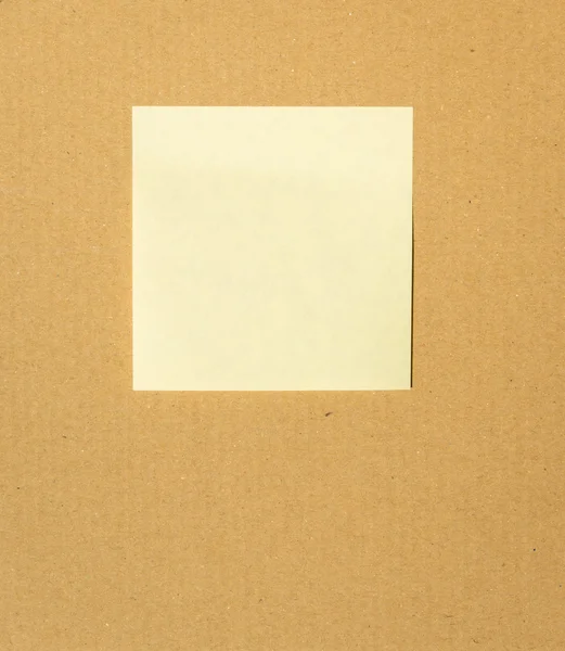 Yellow color note on cardboard paper