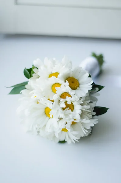 Wedding bouquet of camomile on a white background