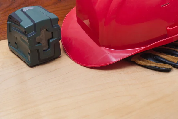 Construction helmet and laser level