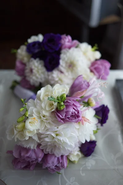 The groom in a suit or Young girl-bride or bridesmaid is holding a wedding bouquet