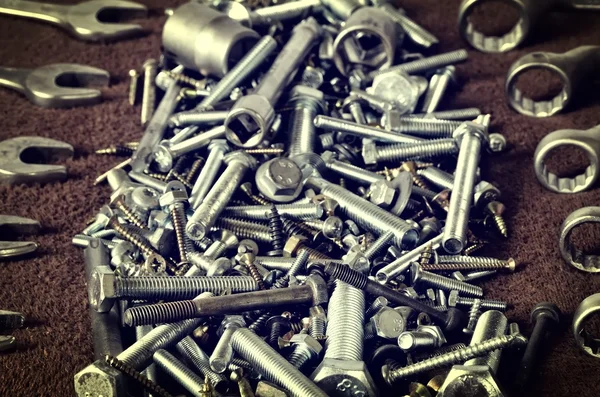 Group of screws and wrenches.