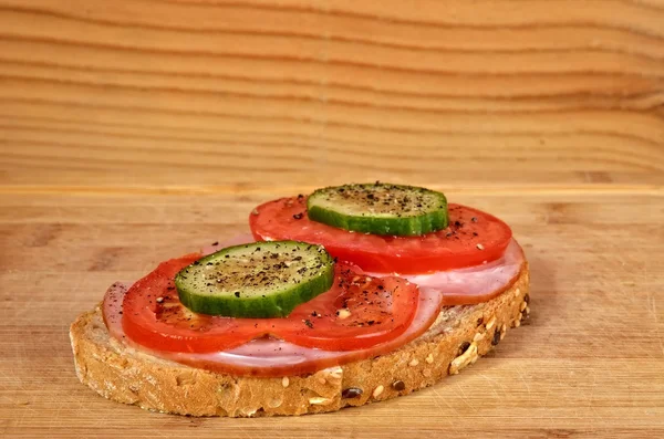 Sandwich on a cutting board.
