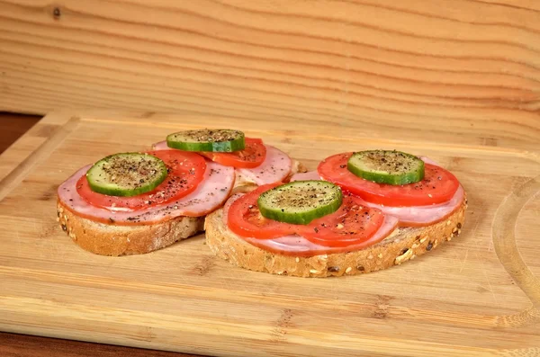 Sandwich on a cutting board.