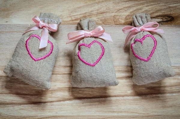 Cloth bags with pink hearts.