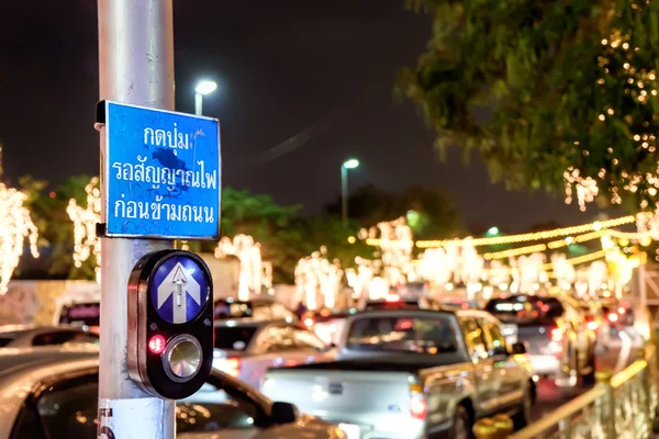 Push button for Red traffic light in Thailand, thai language.