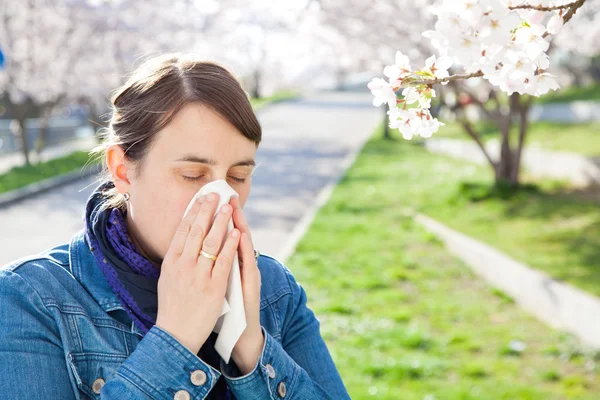 Woman sneezes hay fever