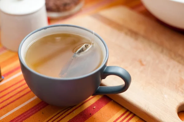 Cup of tea in the kitchen with tea bag