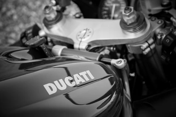 Red ducati motorcycle 996s. Reservoir sign, black and white photo.