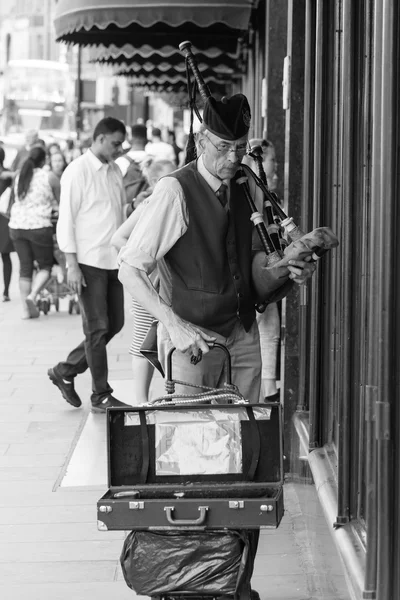 Street music performer preparing for show