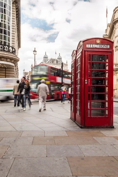 Red telephone box and red bus at London