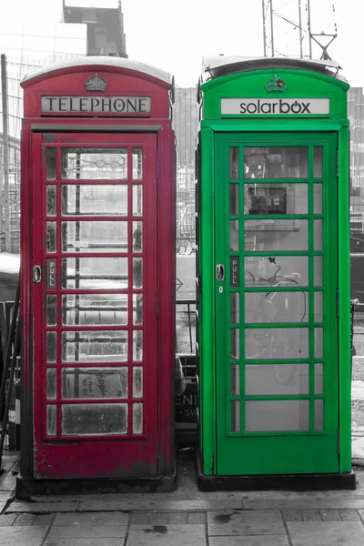 Red and green telephone box black and white photography selective color