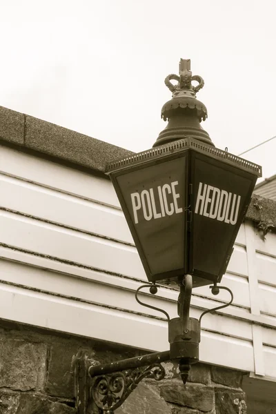 Old Wales Police Gas Lamp (Heddlu) in sepia tone