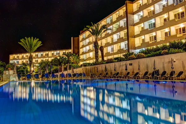 Mellieha Bay Hotel by night pool view A, Mellieha, Malta