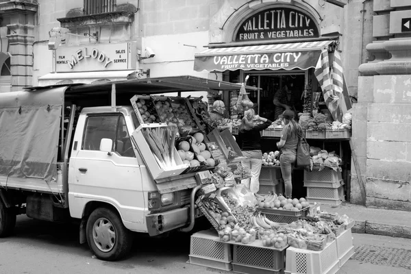 Sales in the street in Valletta, unidentified people