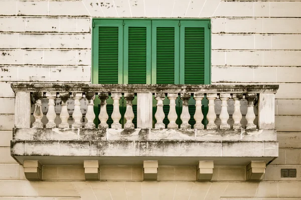 Green shutters balcony