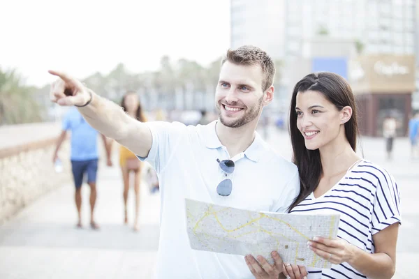 Summer holidays, dating, city break and tourism concept - couple with  guide