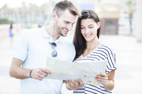 Summer holidays, dating, city break and tourism concept - couple with  guide
