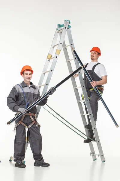 Two handymen at work stair