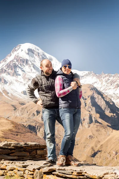 Young couple on a background of mountains