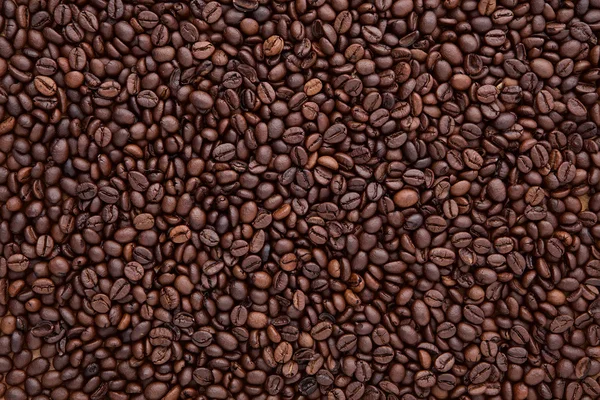 Flat lay of brown roasted coffee bean can be used as a backgroun