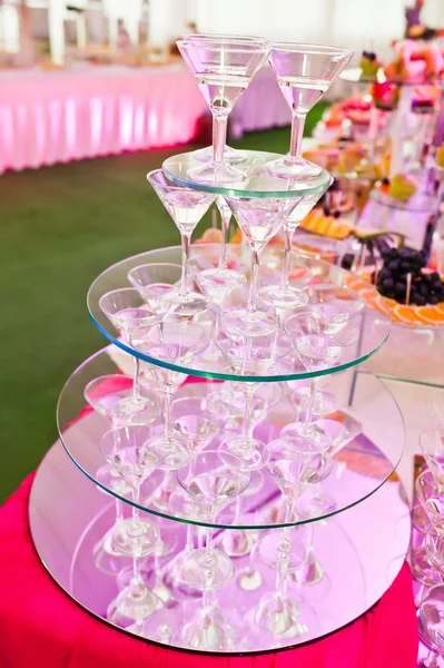 Awesome wedding reception of food and drink with various pink li