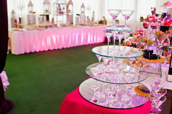 Awesome wedding reception of food and drink with various pink li