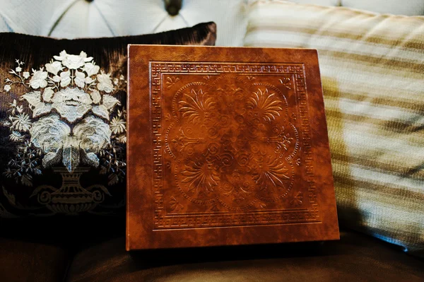 Brown leather wedding book and album, cover with stamping