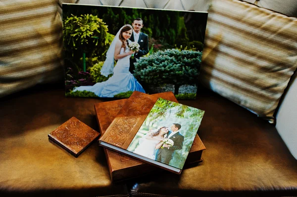 Brown leather wedding book and album with big picture on canvas