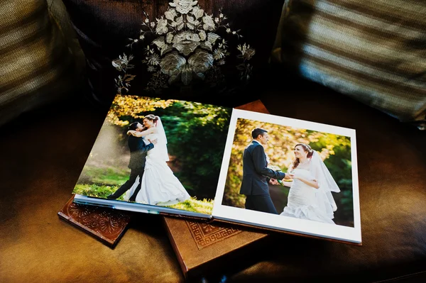 Dual pages of brown leather wedding book and album