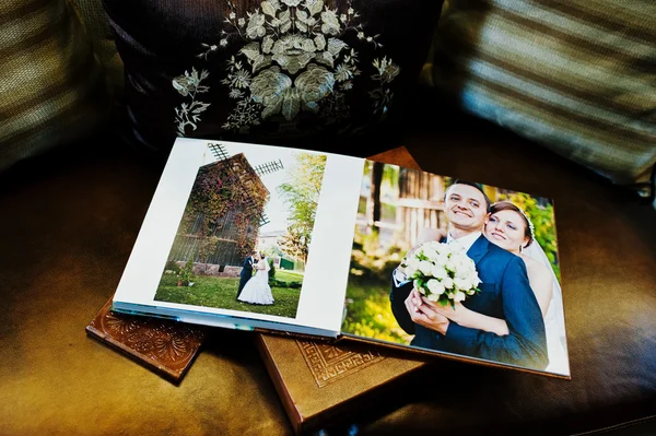 Dual pages of brown leather wedding book and album