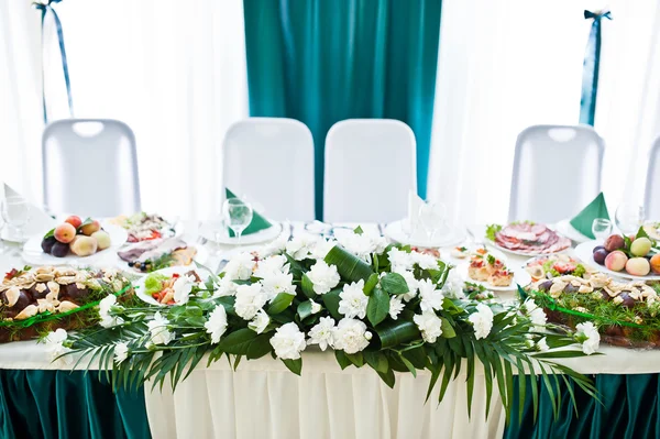 Wedding table of newlyweds with flowers