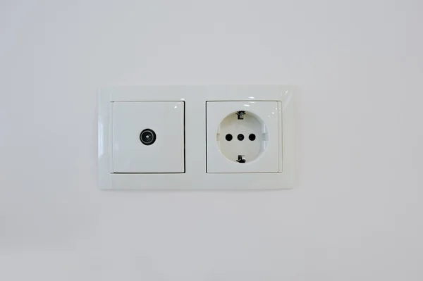 Twin electric socket with tv plug at the wall