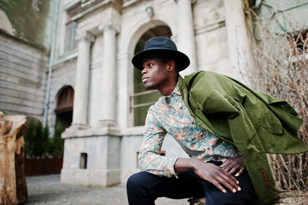 Fashion portrait of black african american man on green velvet j