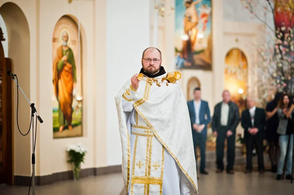 LVIV, UKRAINE - MAY 8, 2016: Priest with a censer at ceremony of
