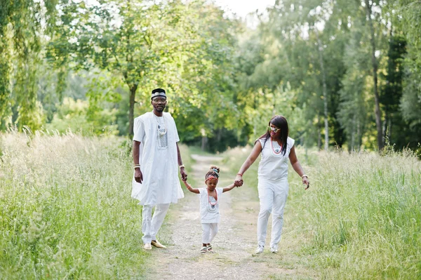 African american family at white nigerian national dress having