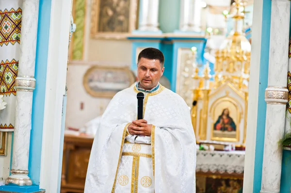 Mukyluntsi , Ukraine - 26 june, 2016: First holy communion. Prie