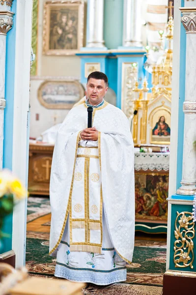 Mukyluntsi , Ukraine - 26 june, 2016: First holy communion. Prie