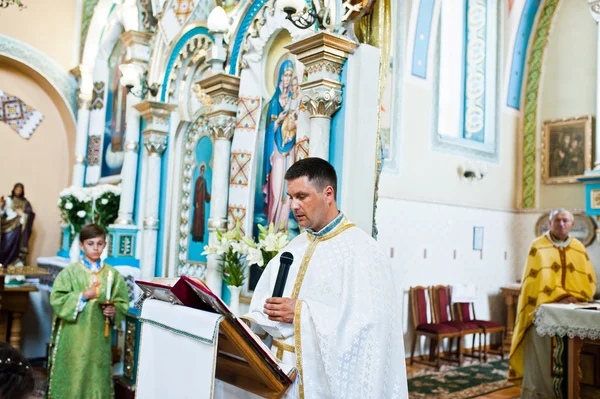 Mukyluntsi , Ukraine - 26 june, 2016: First holy communion. Prie