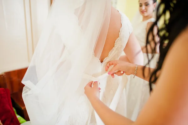 Bridesmaid wear ribbon at  bride dress