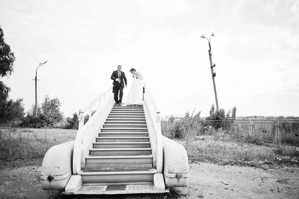 Wedding couple at the ramp plane